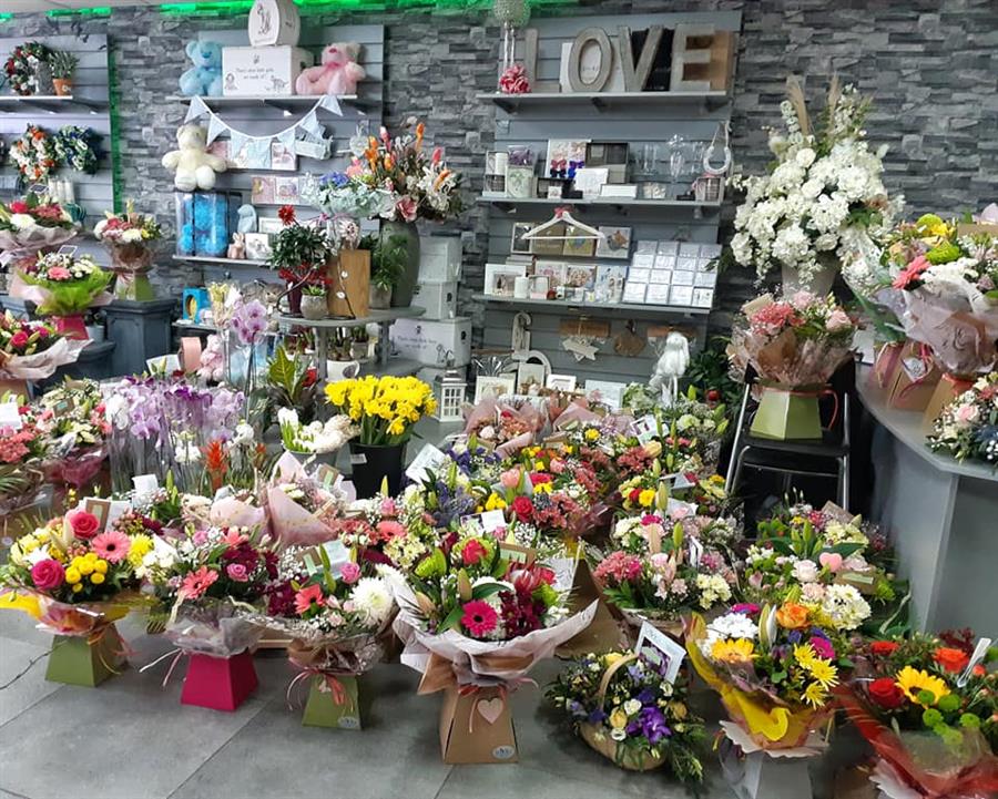 Inside Vivid Floral Design in Wrexham, with hand-tied bouquets and gifts on display