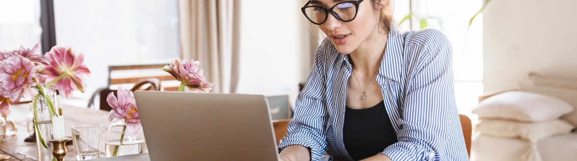 Event florist managing wedding bookings remotely using cloud software