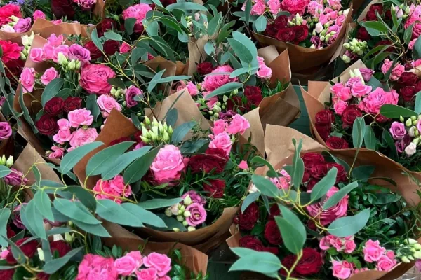Wrapped flower subscription bouquets lined up for regular delivery