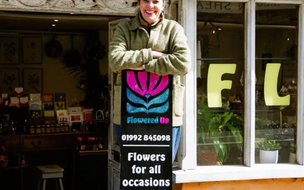 Wendy Shipton at the window of Flowered Up, her florist shop in Hertford